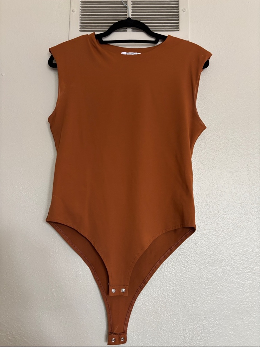 ReoRia Sleeveless One-Piece Bodysuit in Rust Orange